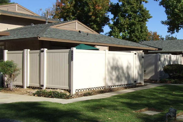 white privacy fencing around home